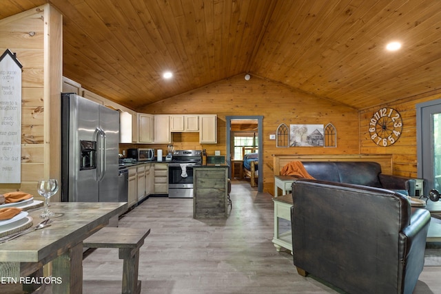 kitchen featuring wood ceiling, wooden walls, appliances with stainless steel finishes, light wood-type flooring, and vaulted ceiling