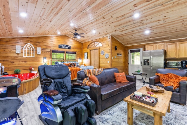 living room with wood walls, wooden ceiling, ceiling fan, light wood-type flooring, and vaulted ceiling