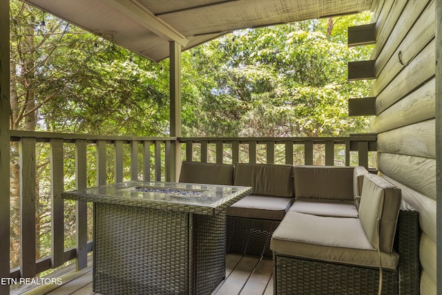 wooden deck featuring an outdoor living space