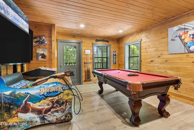 rec room with light hardwood / wood-style floors, wooden ceiling, billiards, and wooden walls