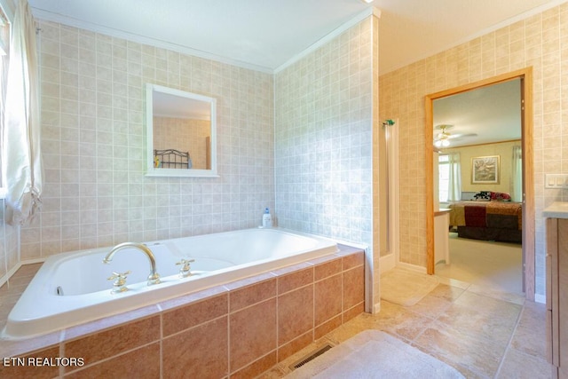 bathroom featuring ceiling fan, crown molding, tile walls, and tile patterned flooring