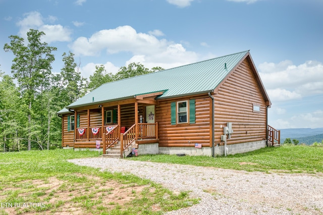 log home with covered porch