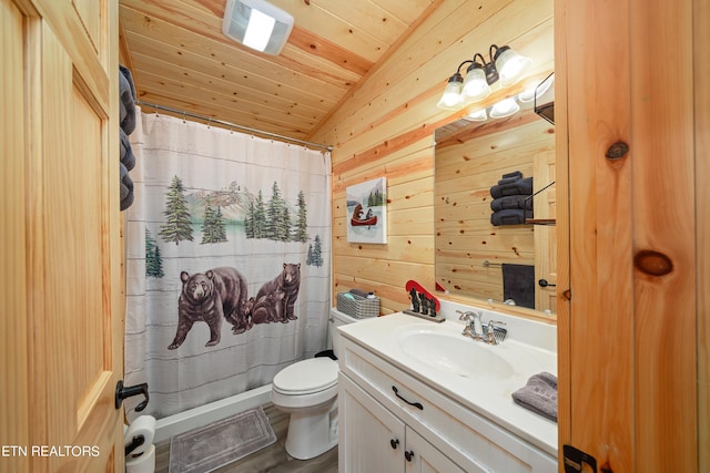 bathroom with toilet, wood walls, wooden ceiling, lofted ceiling, and vanity