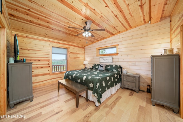 bedroom featuring wood ceiling, wooden walls, light hardwood / wood-style floors, vaulted ceiling, and ceiling fan