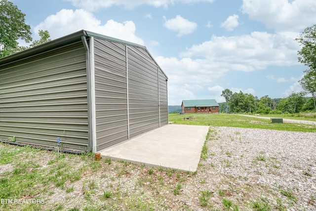 view of outbuilding with a lawn