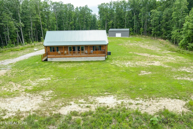 log home with a front yard and a porch