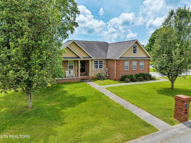 craftsman house featuring a front yard and covered porch