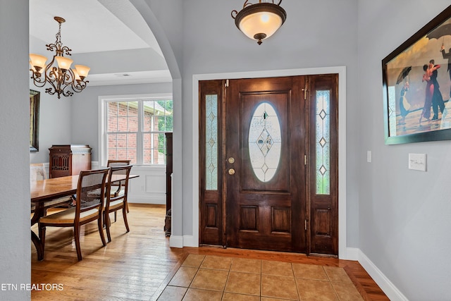 foyer featuring a notable chandelier and light hardwood / wood-style floors