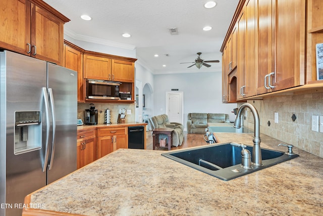 kitchen with ceiling fan, backsplash, sink, appliances with stainless steel finishes, and ornamental molding