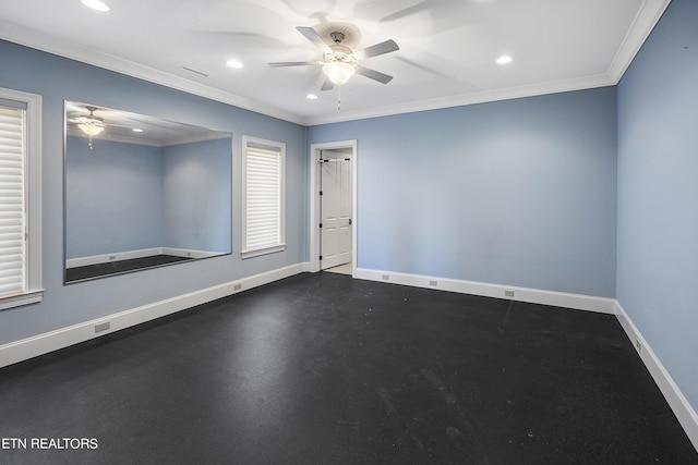 spare room featuring ornamental molding and ceiling fan