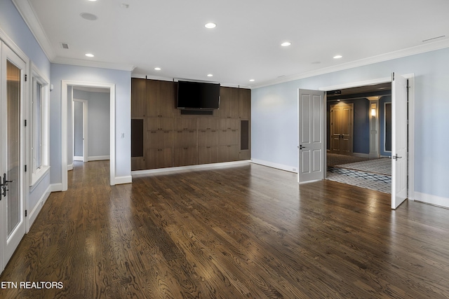 unfurnished living room featuring crown molding and dark hardwood / wood-style floors