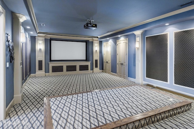 cinema featuring crown molding, carpet floors, and decorative columns