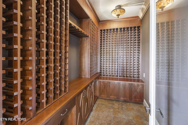 wine cellar featuring crown molding