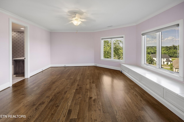 unfurnished room featuring ceiling fan, crown molding, and dark hardwood / wood-style floors