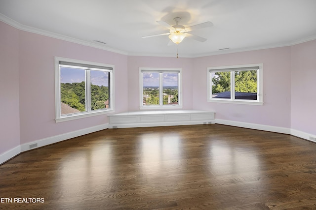 spare room featuring ornamental molding, ceiling fan, and dark hardwood / wood-style floors