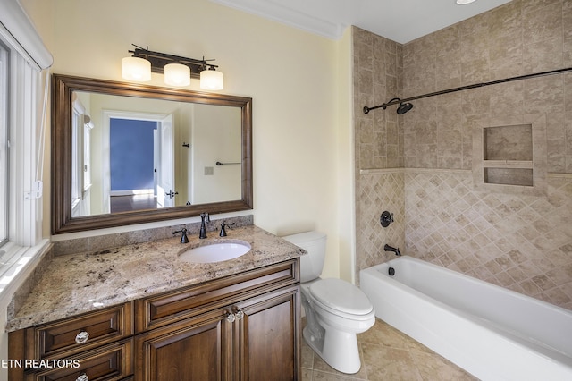 full bathroom with tile patterned flooring, toilet, vanity, tiled shower / bath combo, and crown molding