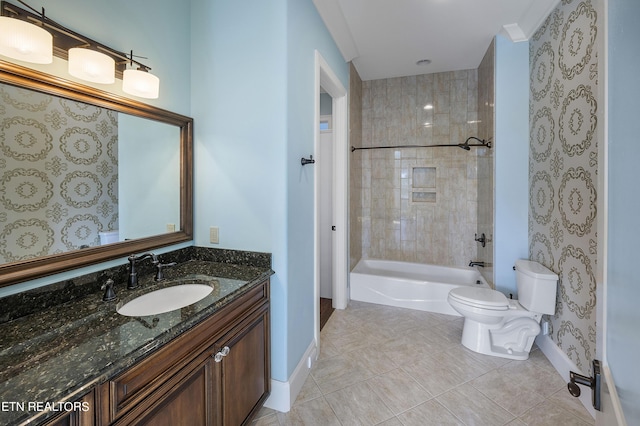 full bathroom with toilet, crown molding, tile patterned floors, vanity, and tiled shower / bath