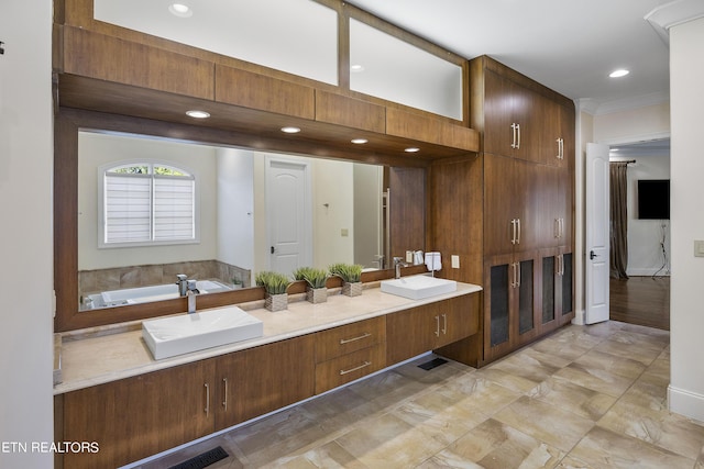 bathroom featuring a bathing tub and vanity