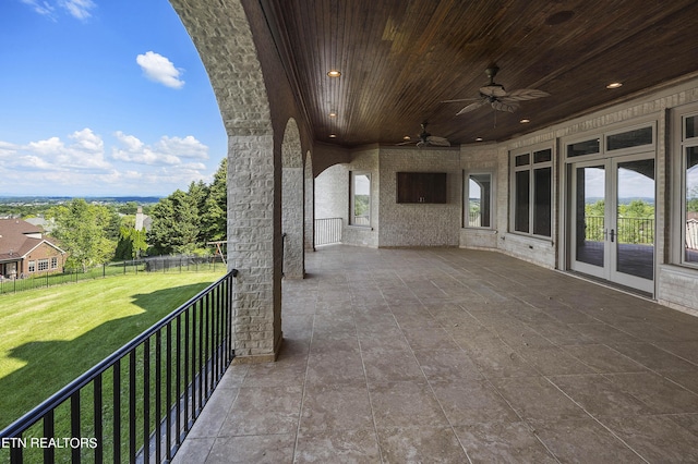 view of patio / terrace featuring ceiling fan and french doors