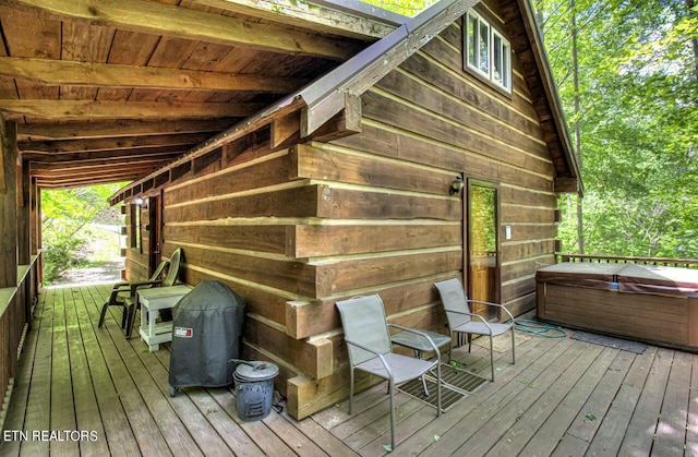 deck featuring a hot tub