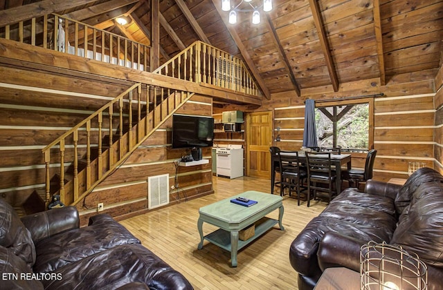 living room with wooden walls, wood ceiling, and hardwood / wood-style flooring