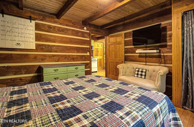 bedroom with beam ceiling and wood ceiling