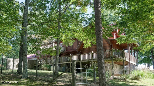 back of property with a wooden deck