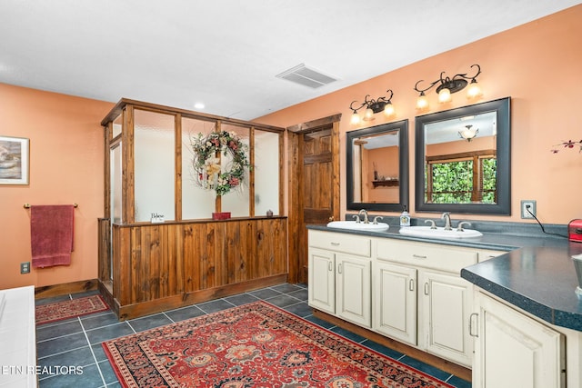 bathroom with vanity and tile patterned flooring