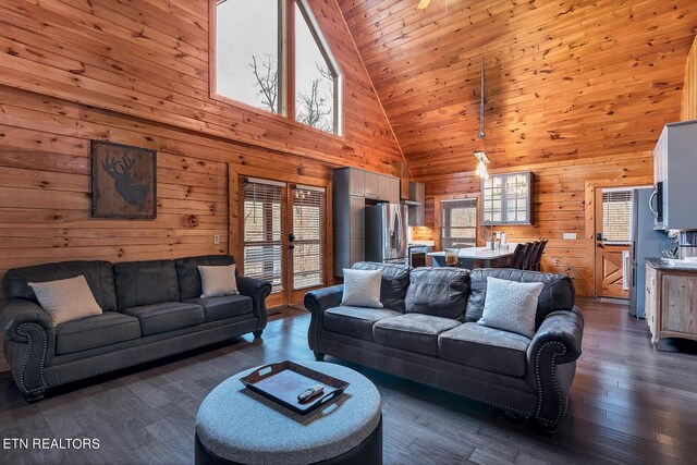 living room with dark hardwood / wood-style flooring, high vaulted ceiling, a wealth of natural light, and wooden ceiling