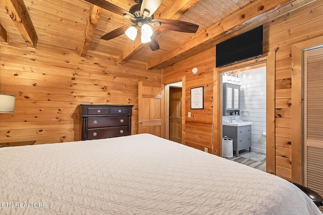 unfurnished bedroom featuring beamed ceiling, wood ceiling, and wooden walls