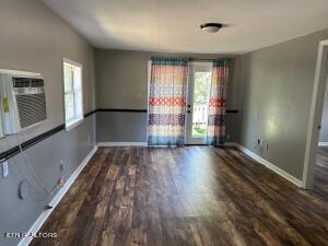 empty room featuring dark wood-type flooring