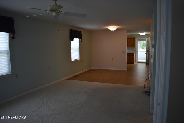 spare room featuring ceiling fan and hardwood / wood-style floors