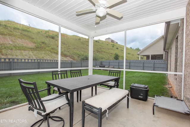 sunroom / solarium with ceiling fan