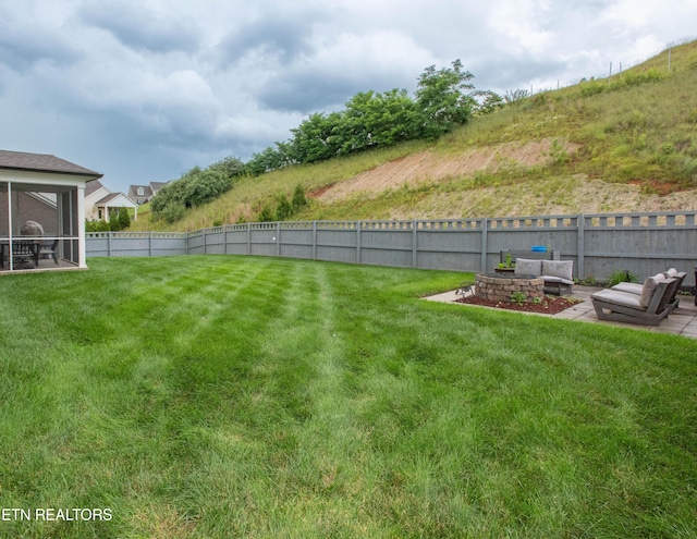 view of yard featuring a fenced backyard and a sunroom