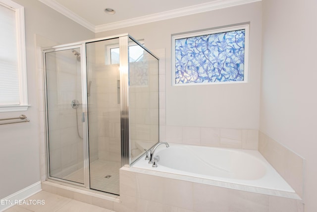 bathroom with a bath, a shower stall, tile patterned floors, and ornamental molding