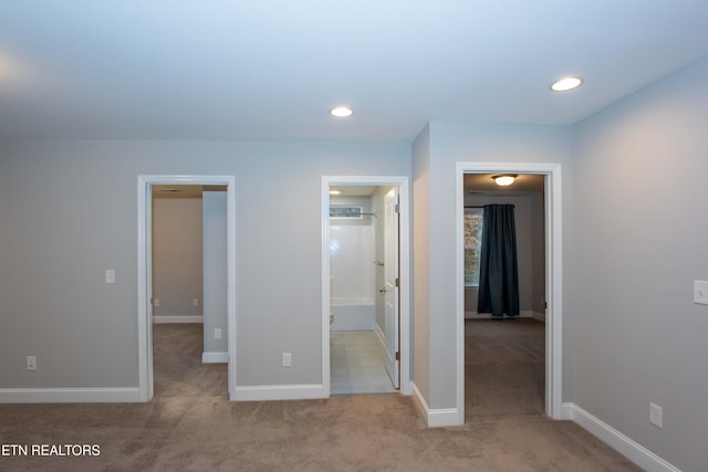 unfurnished bedroom with recessed lighting, baseboards, and carpet flooring