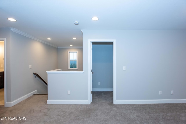 unfurnished room with carpet, crown molding, recessed lighting, and baseboards