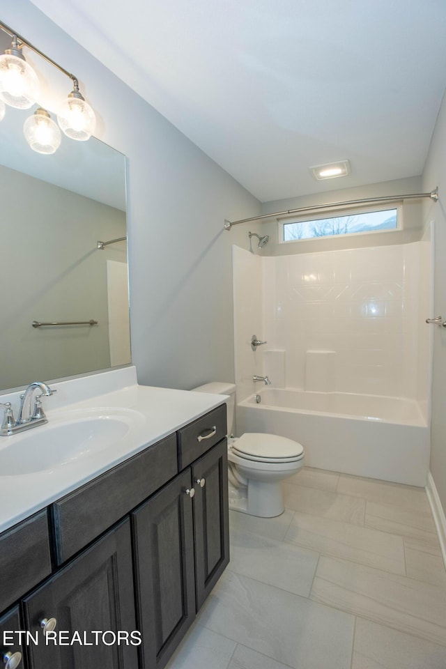 bathroom with vanity, toilet, and shower / tub combination