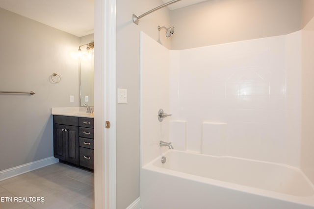 full bathroom with tile patterned floors, vanity, shower / bathing tub combination, and baseboards