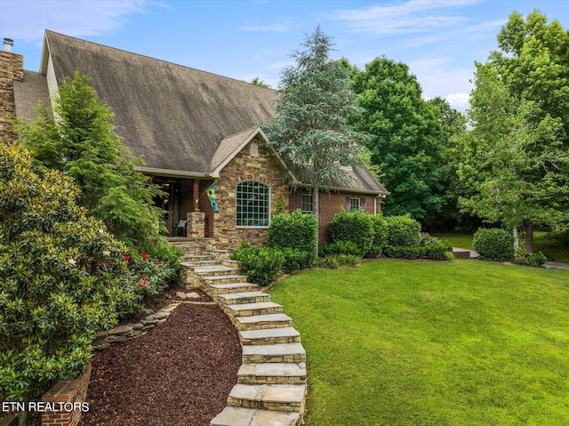 view of front of home with a front yard