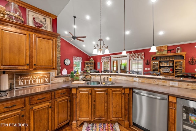 kitchen with sink, beverage cooler, stainless steel dishwasher, pendant lighting, and vaulted ceiling