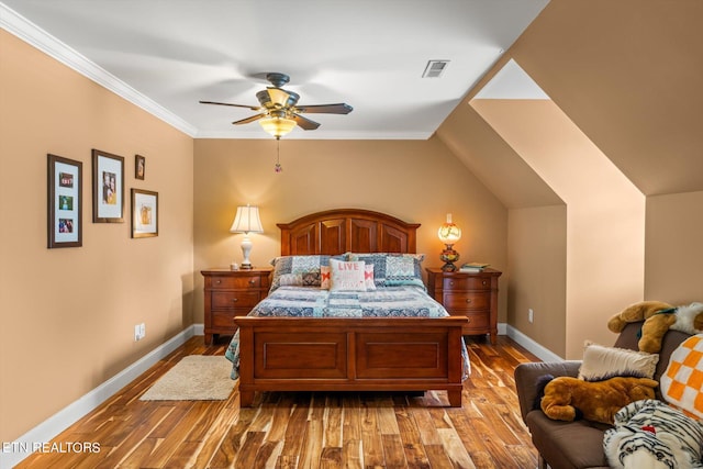 bedroom with light wood-type flooring, ceiling fan, and crown molding