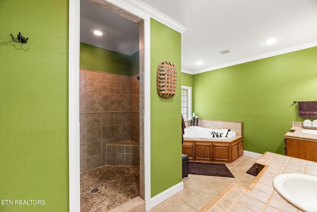 bathroom with tile patterned floors, crown molding, vanity, and separate shower and tub