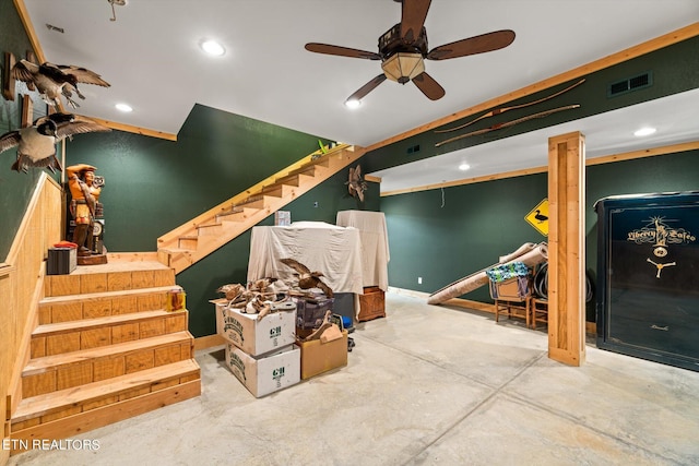 interior space with ceiling fan