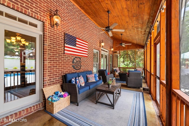 sunroom / solarium featuring ceiling fan, wood ceiling, and vaulted ceiling