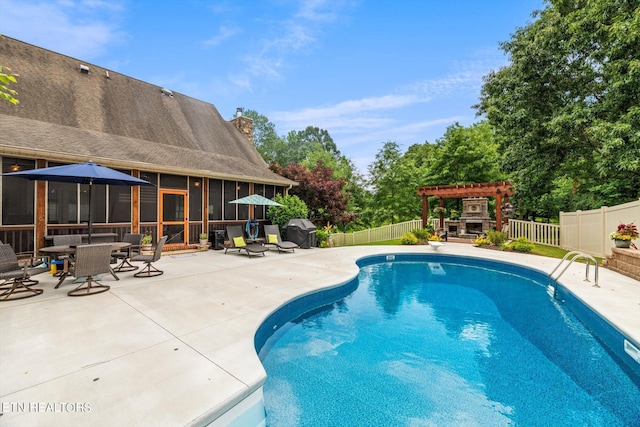 view of swimming pool featuring a sunroom, a grill, a patio area, and a pergola