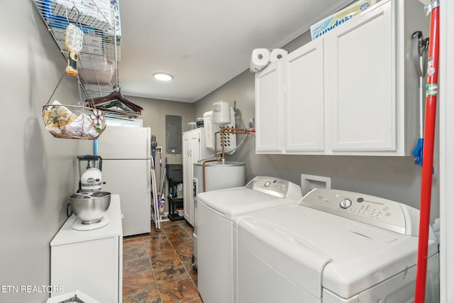 laundry area featuring cabinets, electric panel, and separate washer and dryer