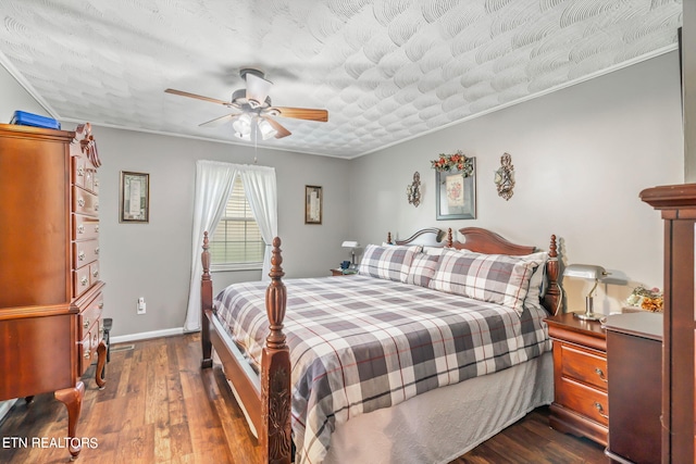 bedroom with ceiling fan, crown molding, dark wood-type flooring, and a textured ceiling