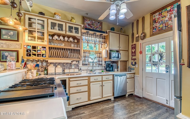 kitchen featuring dishwasher, dark wood-type flooring, sink, ceiling fan, and white gas stove