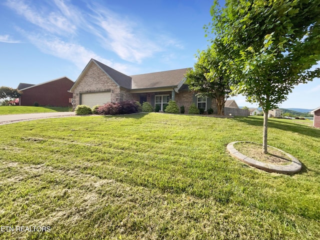 ranch-style house with a front lawn and a garage